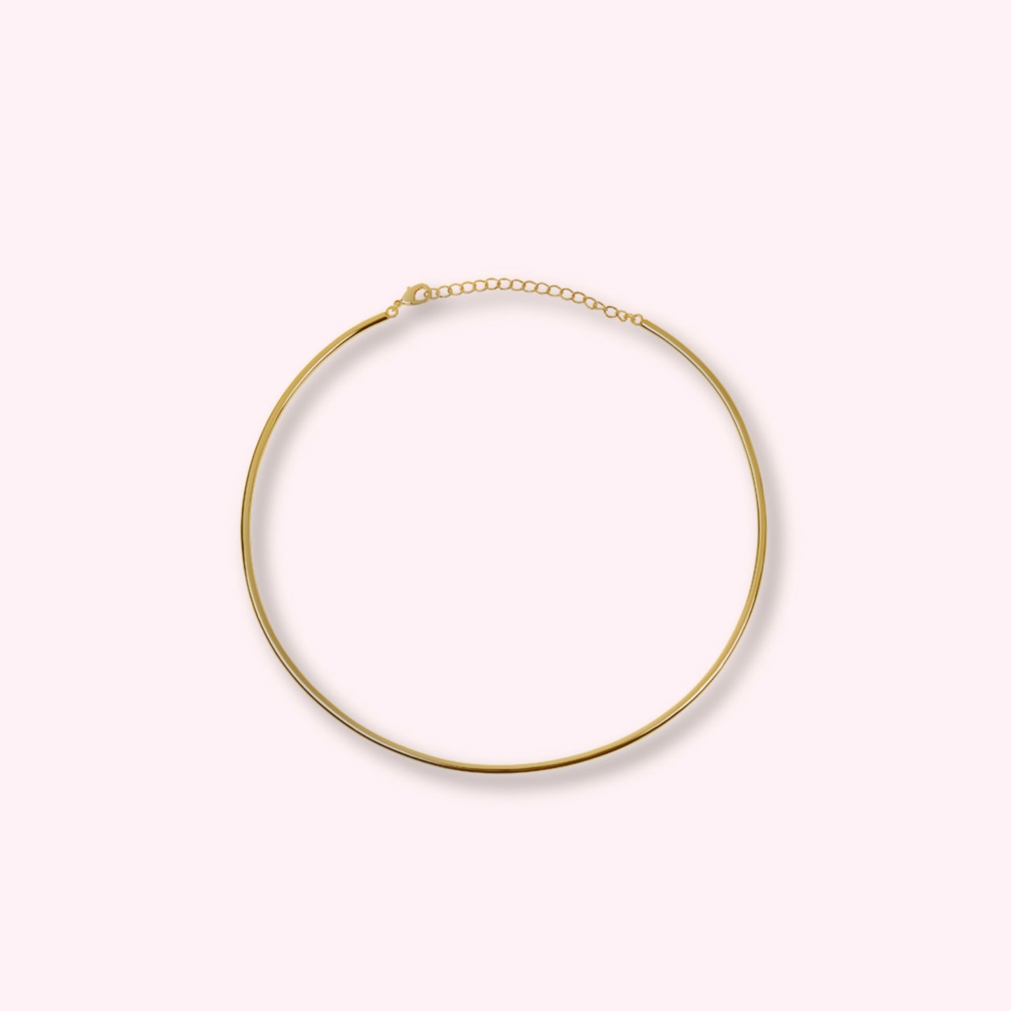 Hard gold choker — polished gold-tone rigid collar necklace, minimal and stackable.